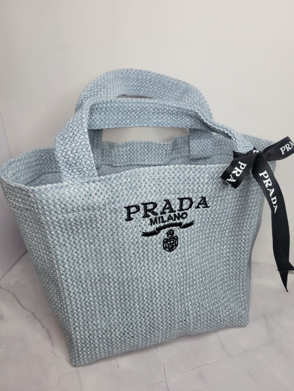 Prada Light Blue Raffia Tote with Black Logo Ribbon